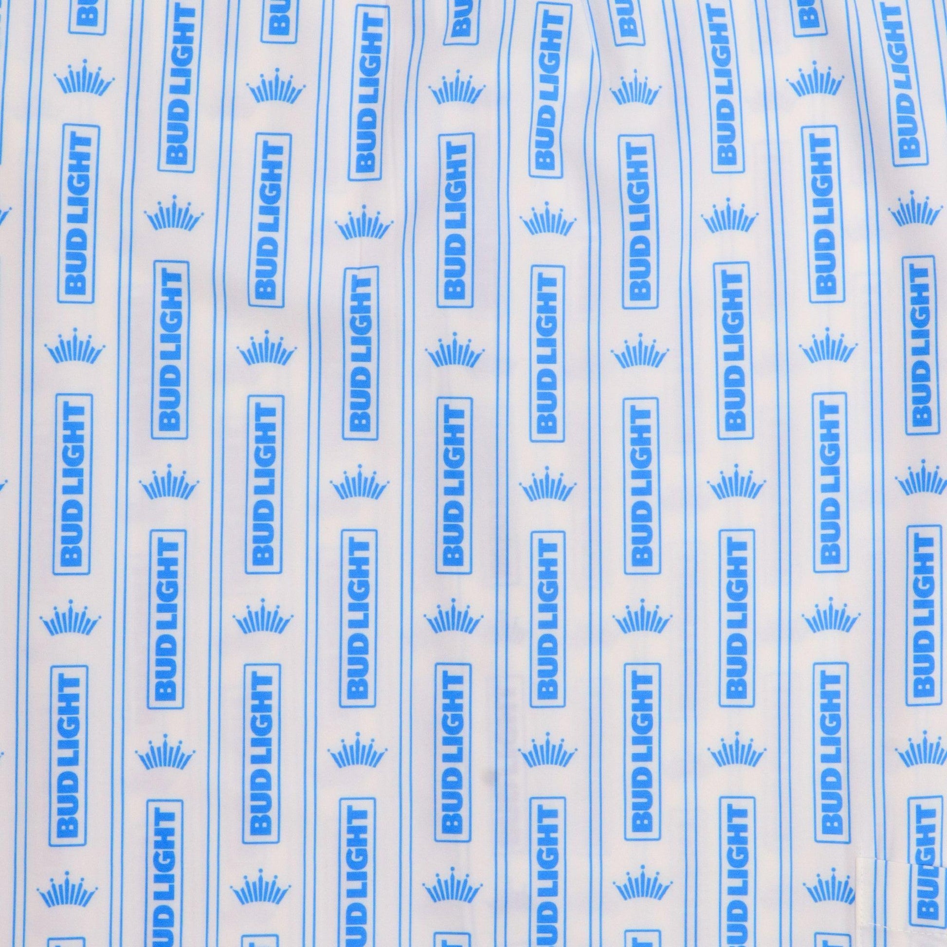 close up of white camp shirt with blue bud light crown stripe