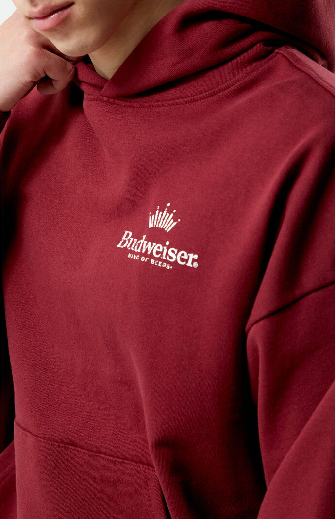 Close up on front logo of hoodie, while model wear it