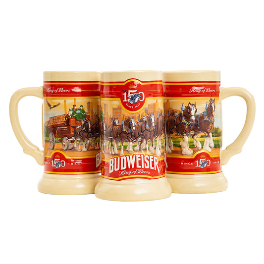 Budweiser 150th (2026 Holiday Stein ) Anniversary King of Beer steins arranged together on a white background, featuring a classic red and gold label with illustrations of horses and beer glasses.