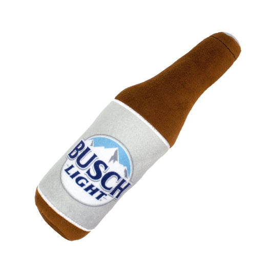 A plush dog toy shaped like a Busch Light beer bottle, featuring a brown faux-leather body and a white fabric neck with the Busch Light logo.