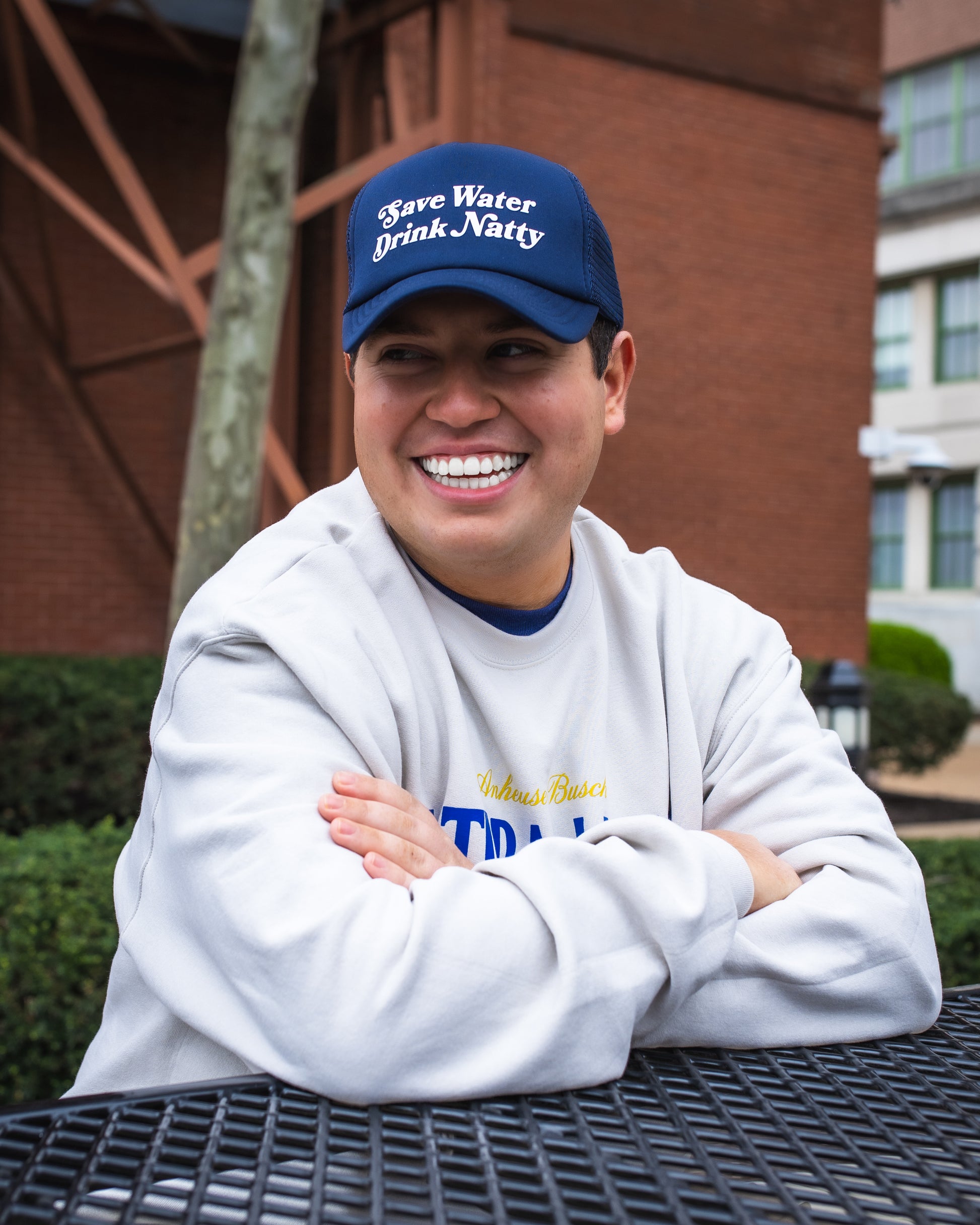 Model wearing "Save Water Drink Natty" Trucker Hat