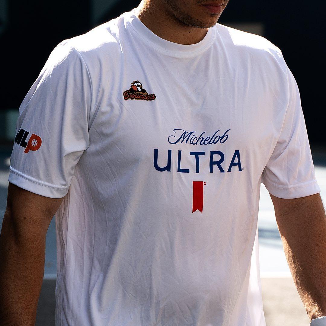 Person wearing Michelob ULTRA Atlanta bouncers T-Shirt