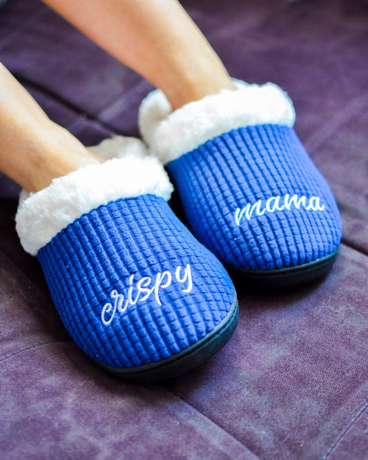 blue and white bud light slippers that say crispy on the right slipper and mama on the left