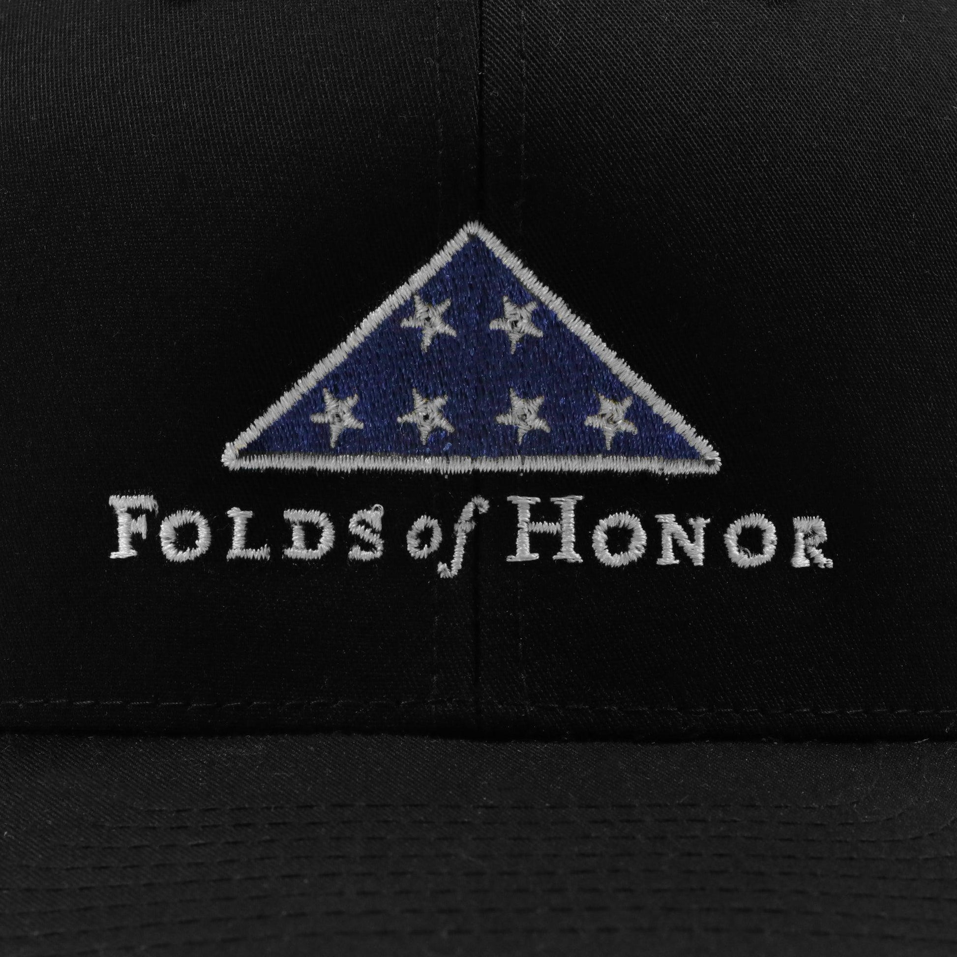 CLOSE UP OF FOLDS OF HONOR EMBROIDERY ON FRONT OF HAT