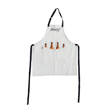 white Budweiser apron with two front pockets with screen printed bottles "inside" the pockets with necks sticking out. features the Budweiser bowtie logo on the front chest of apron.