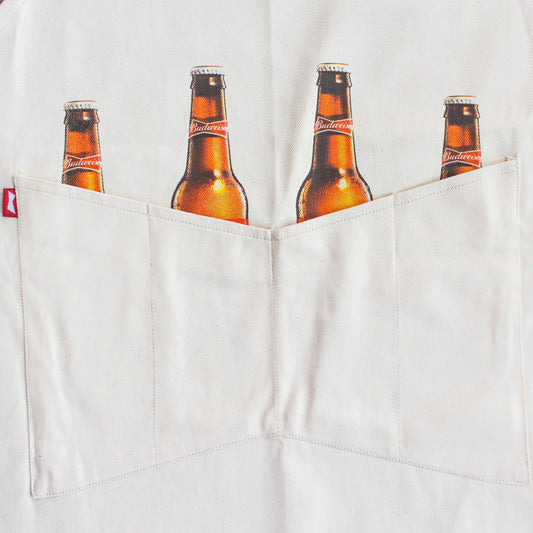 Close up of the Budweiser bottles sticking out of the pockets