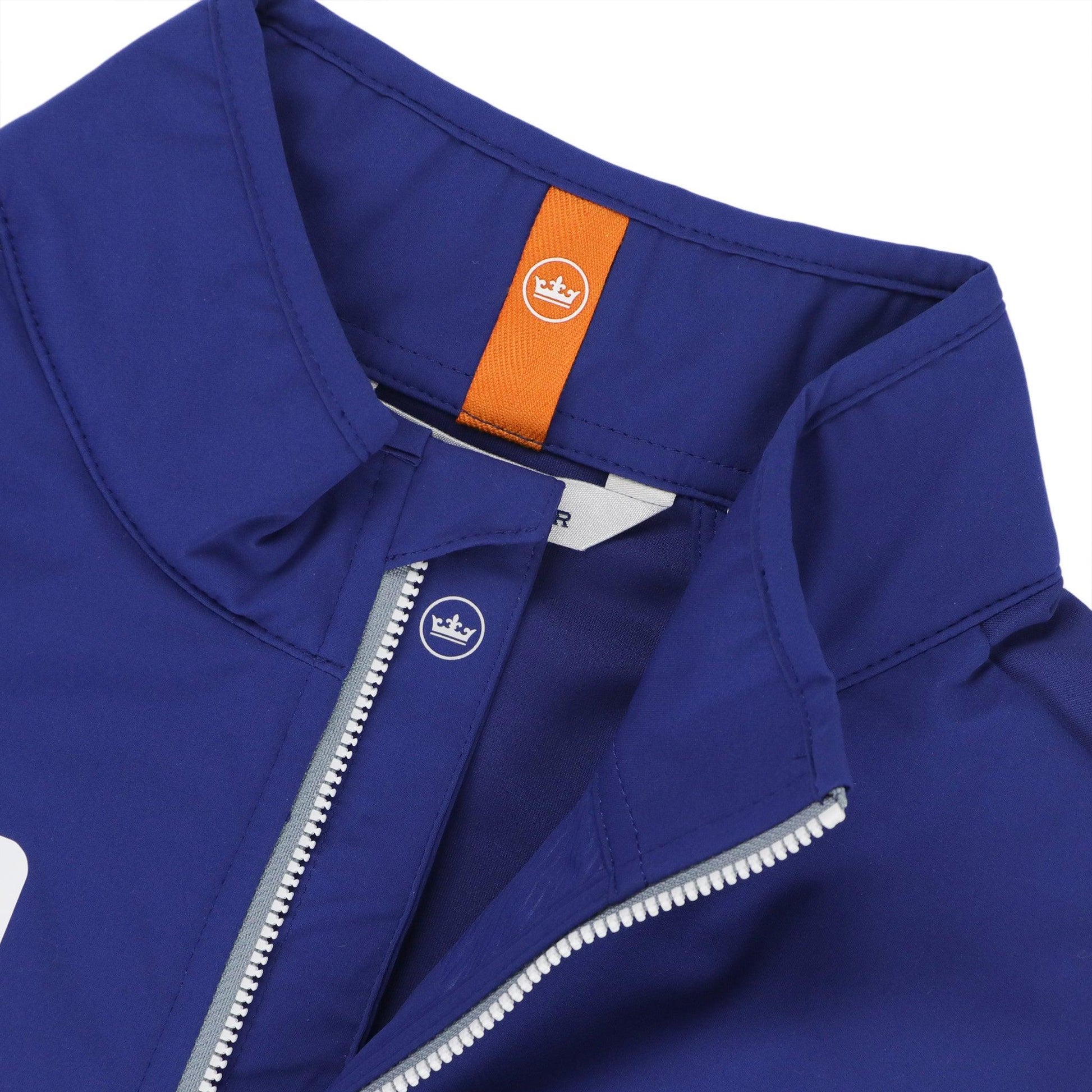 Close up of peter millar logo on the inside neck and zipper