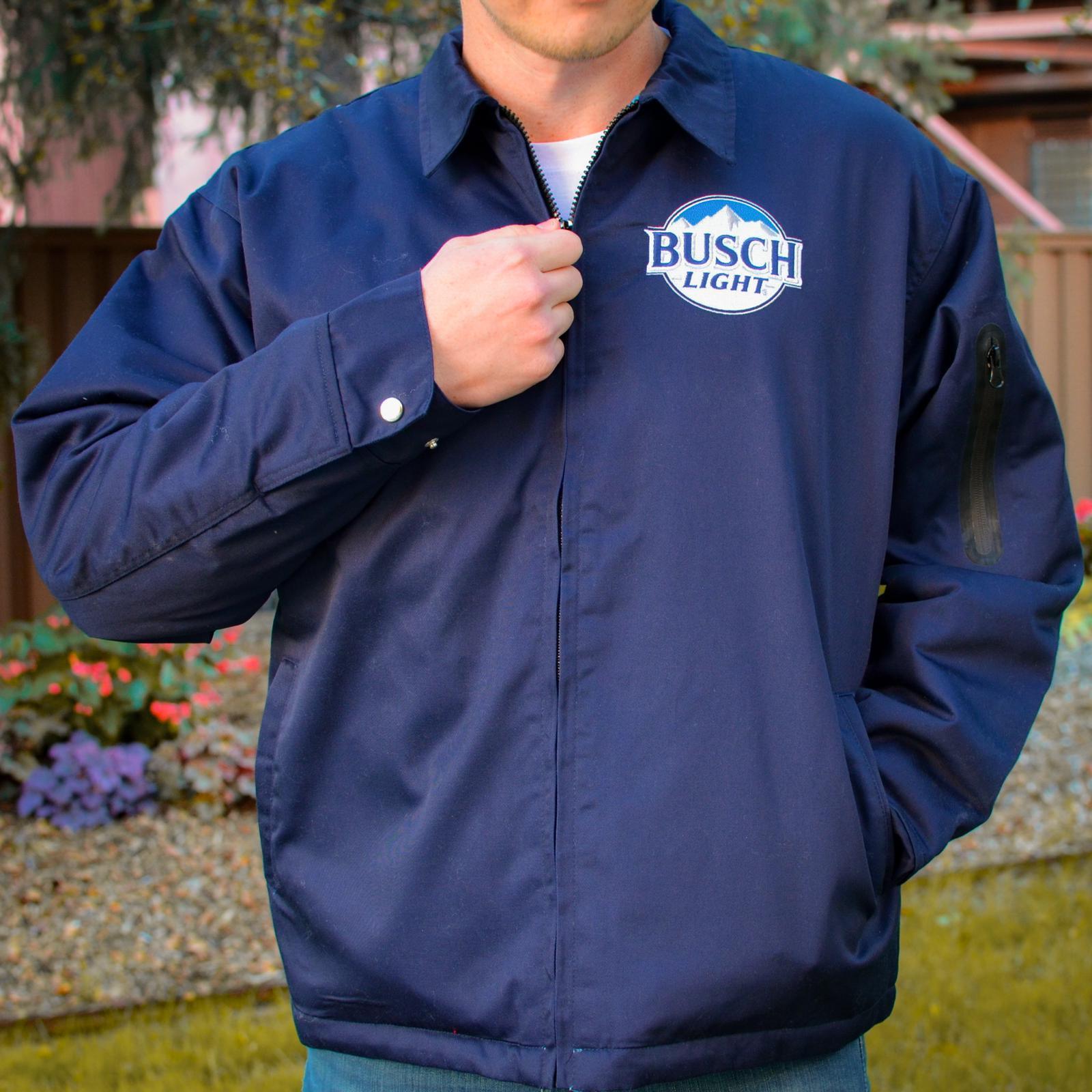 Lifestyle of navy jacket with a zipper pocket on the left arm