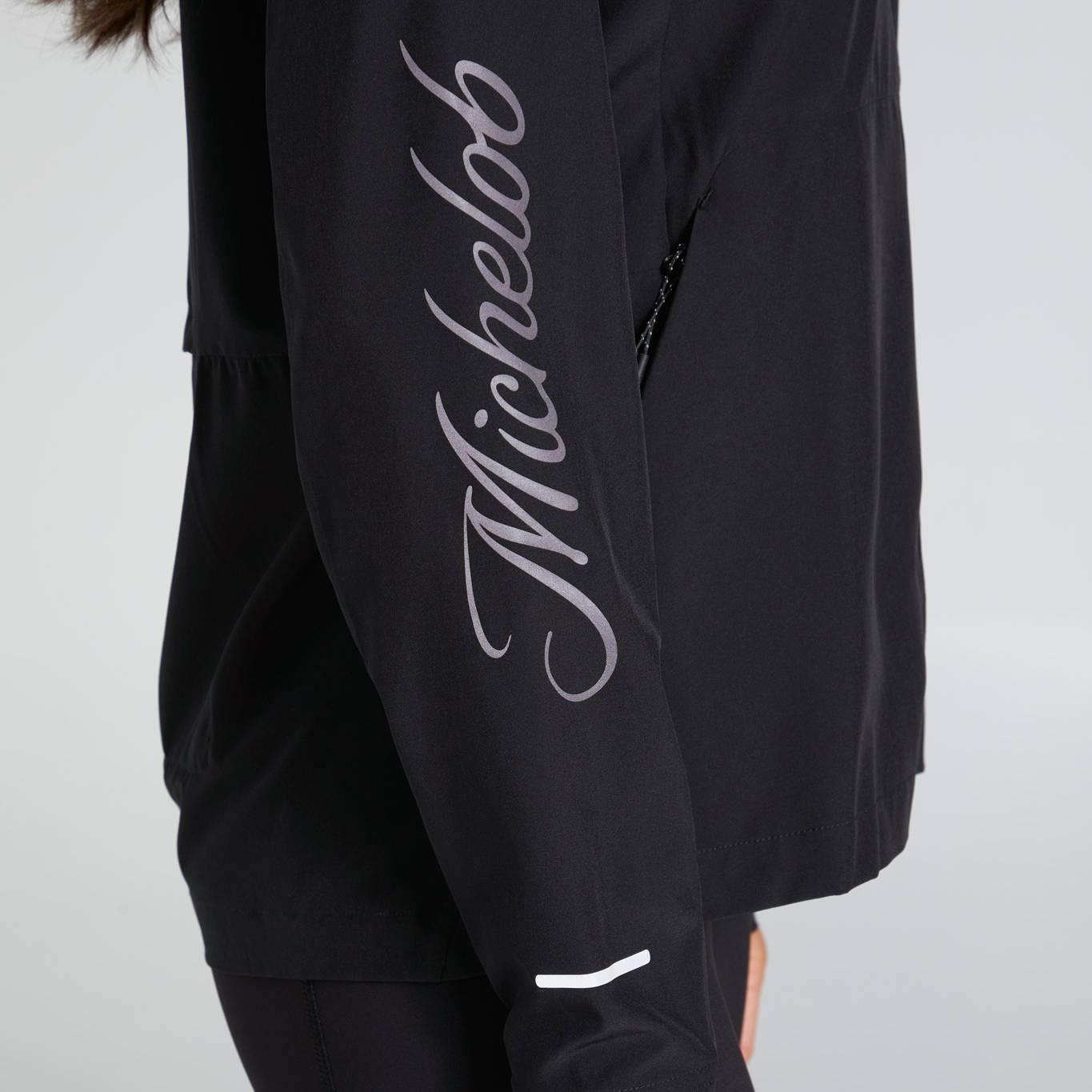 side view of jacket with Michelob in script font going down the right arm in gray