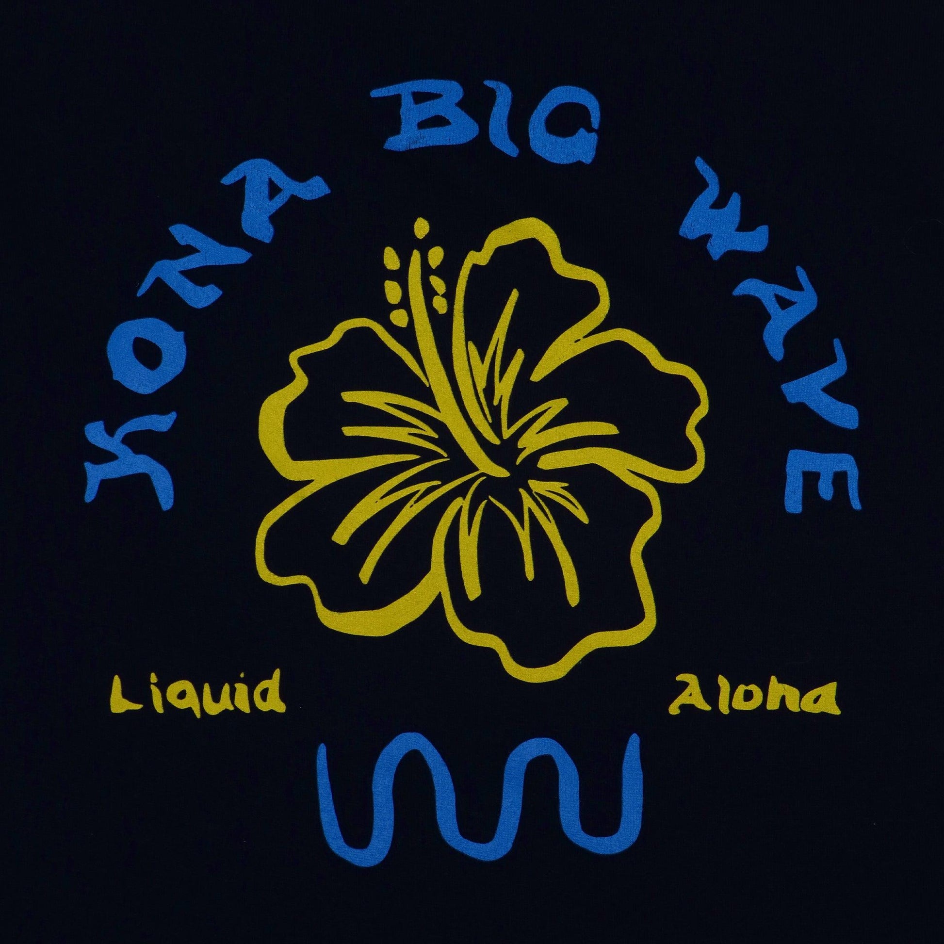 close up of the decoration on the back features large yellow hibiscus flower  and says Kona big wave liquid aloha
