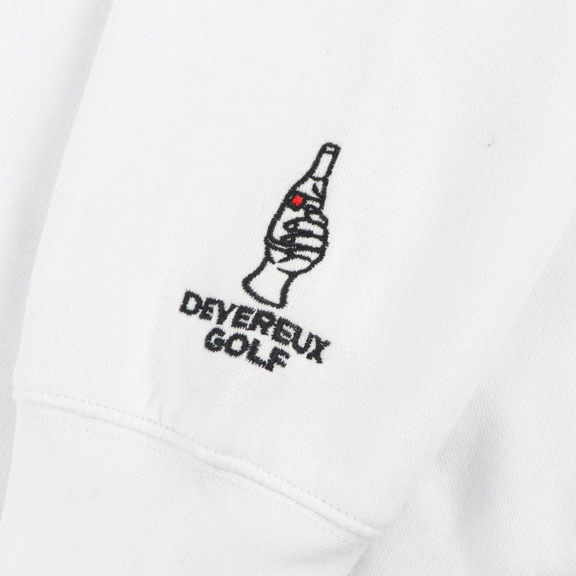 Embroidered Devereaux golf with hand holding bottle of ULTRA. this is featured on lower sleeve by cuff.