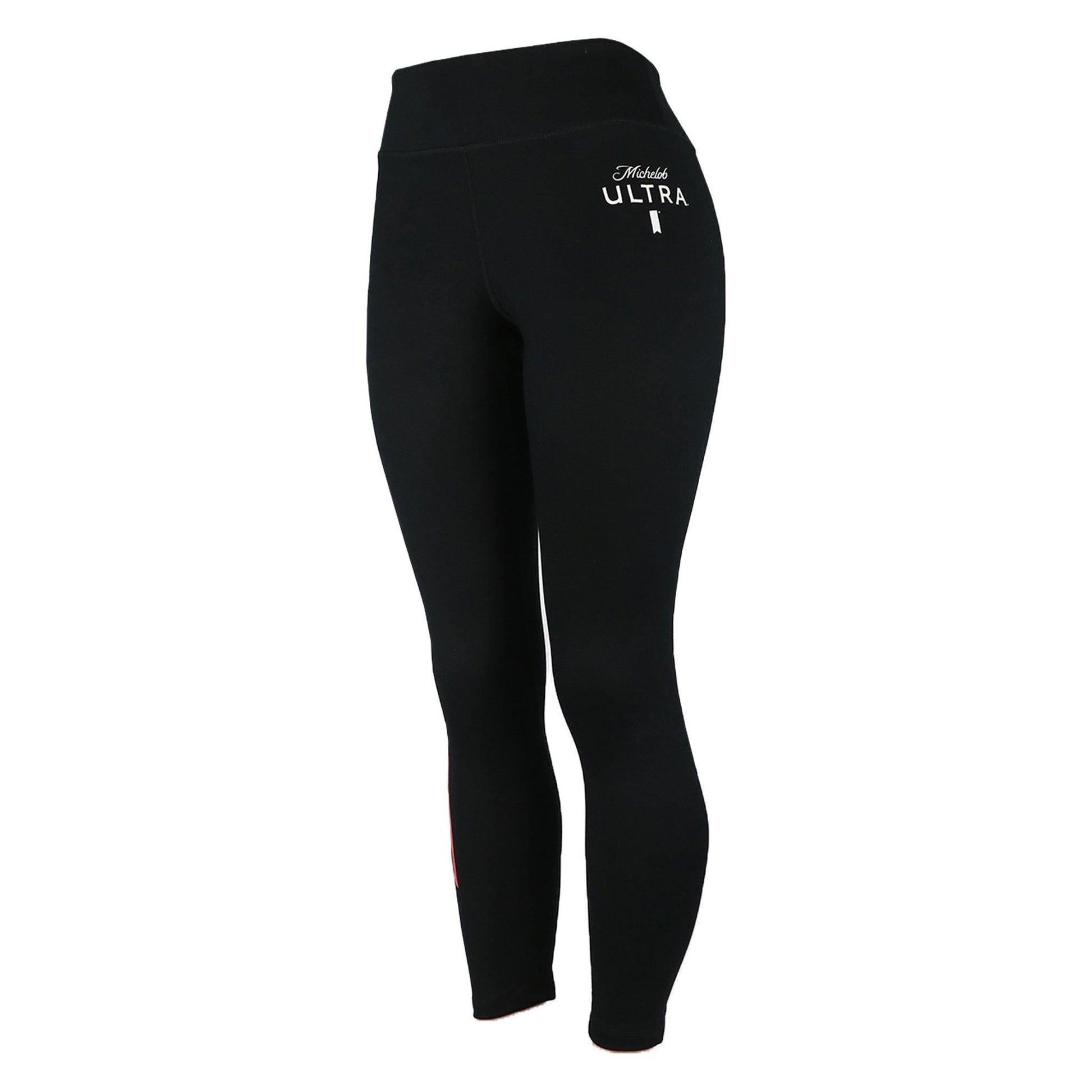 black michelob ultra womens yoga pants with red ribbon on right side of leg and michelob ultra logo on left upper thigh