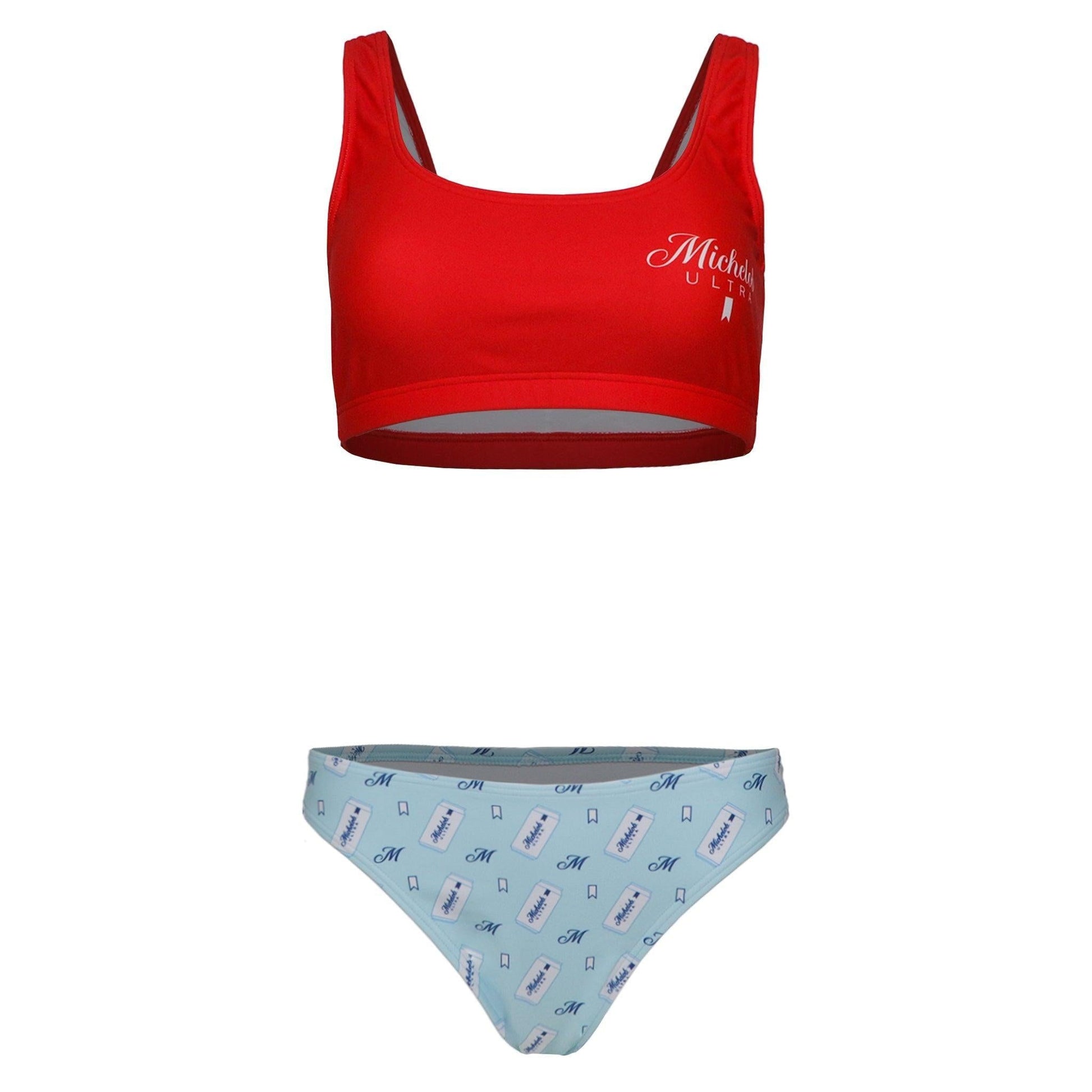 Michelob ULTRA two piece swimsuit set. Top is red with Michelob ULTRA logo on front left chest. Bottoms are light blue with an M, Ultra ribbon, and a can of Michelob ULTRA scattered 
