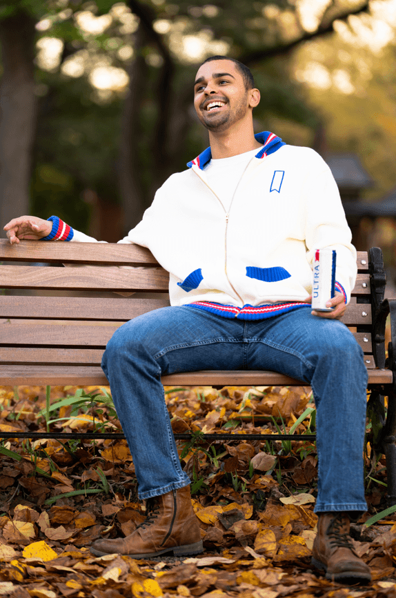 model wearing sweater showcasing front