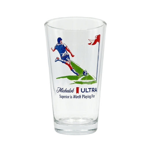Clear glass with soccer-themed design and Michelob Ultra branding on a white background