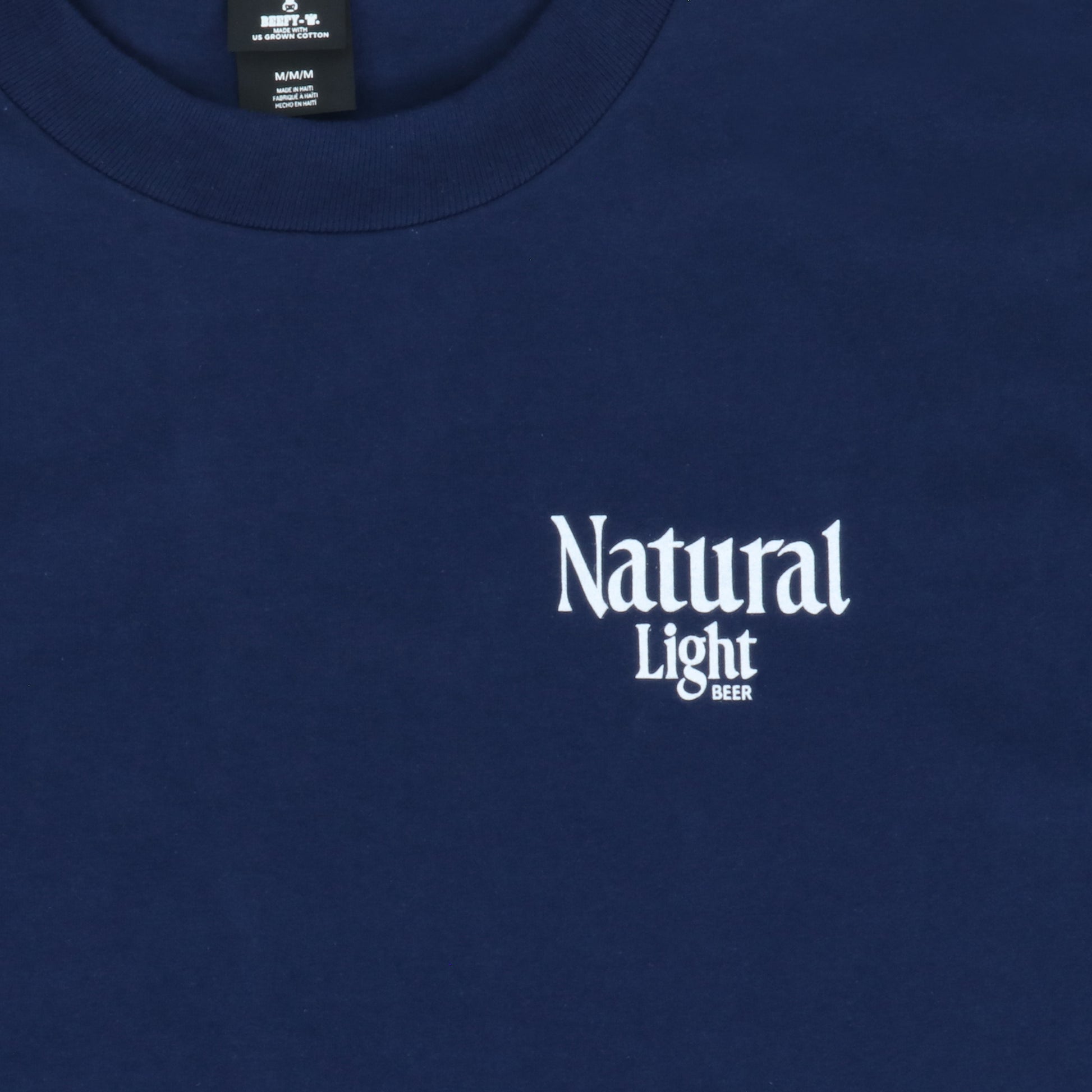 Navy blue shirt with 'Natural Light Beer' logo on a plain background