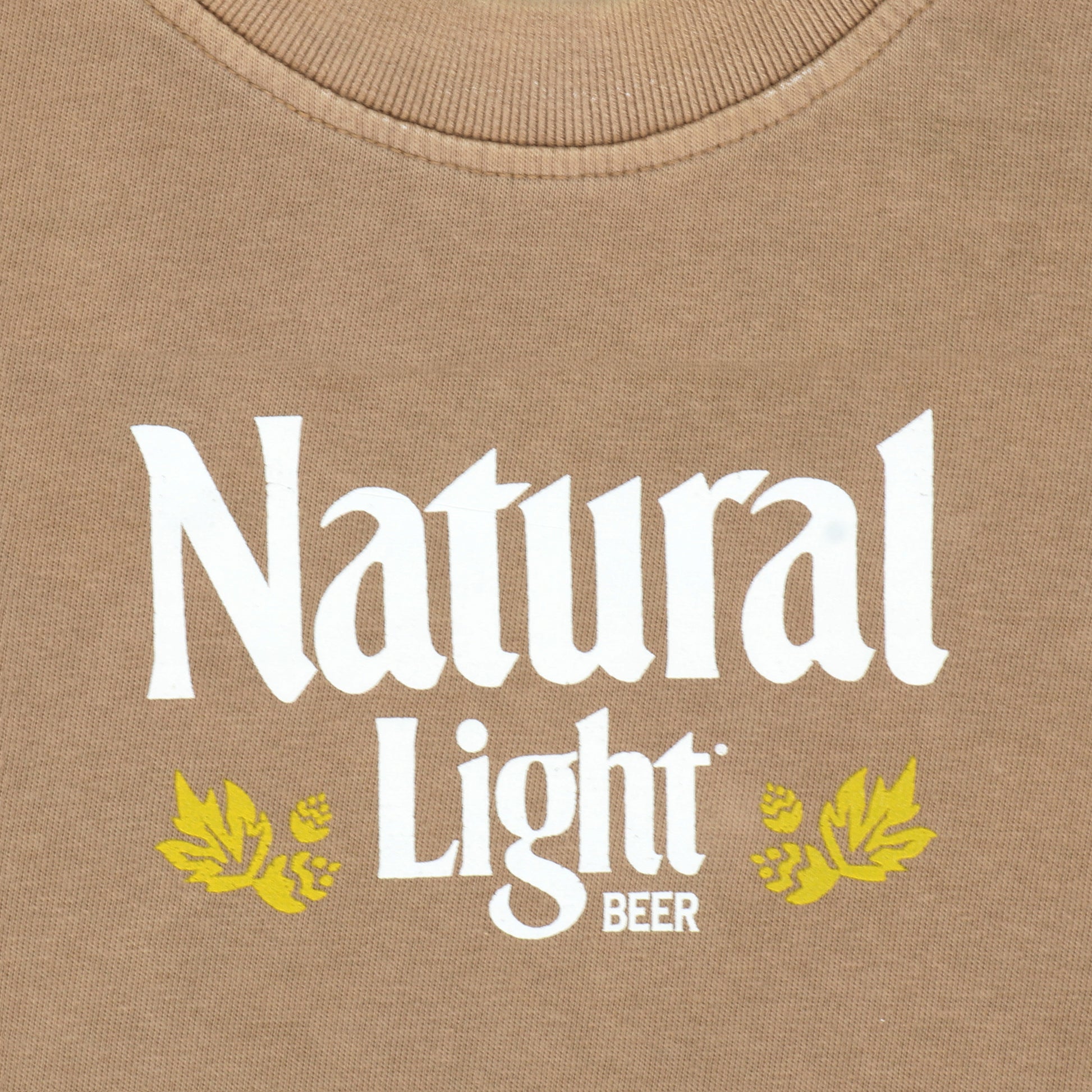 Close up of logo on Natural Light Classic Heavy Weight T-Shirt