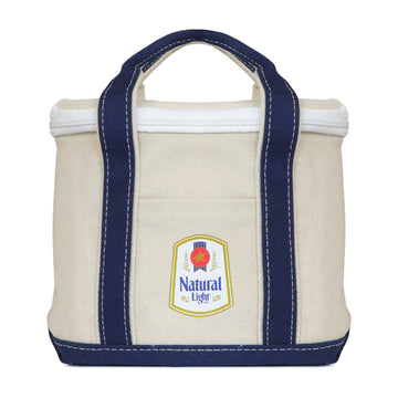 Oatmeal colored canvas 12 can cooler with navy bottom and navy handles with Natural light vintage logo on front pocket. top zipper enclosure
