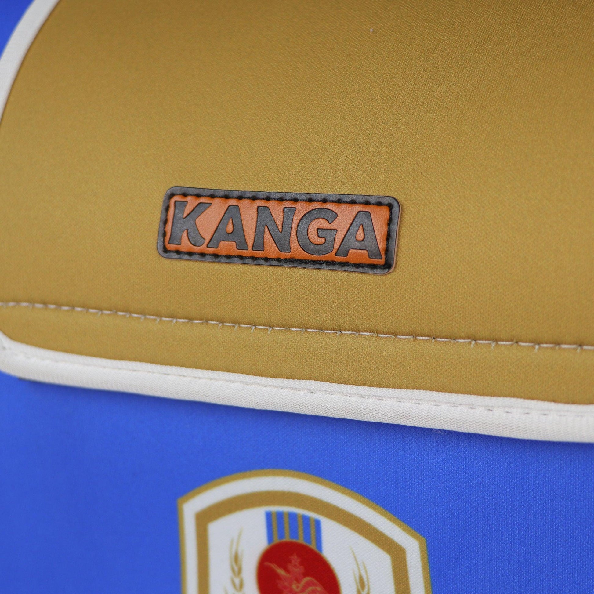 Close up of leather Kanga logo patch on flap of the cooler