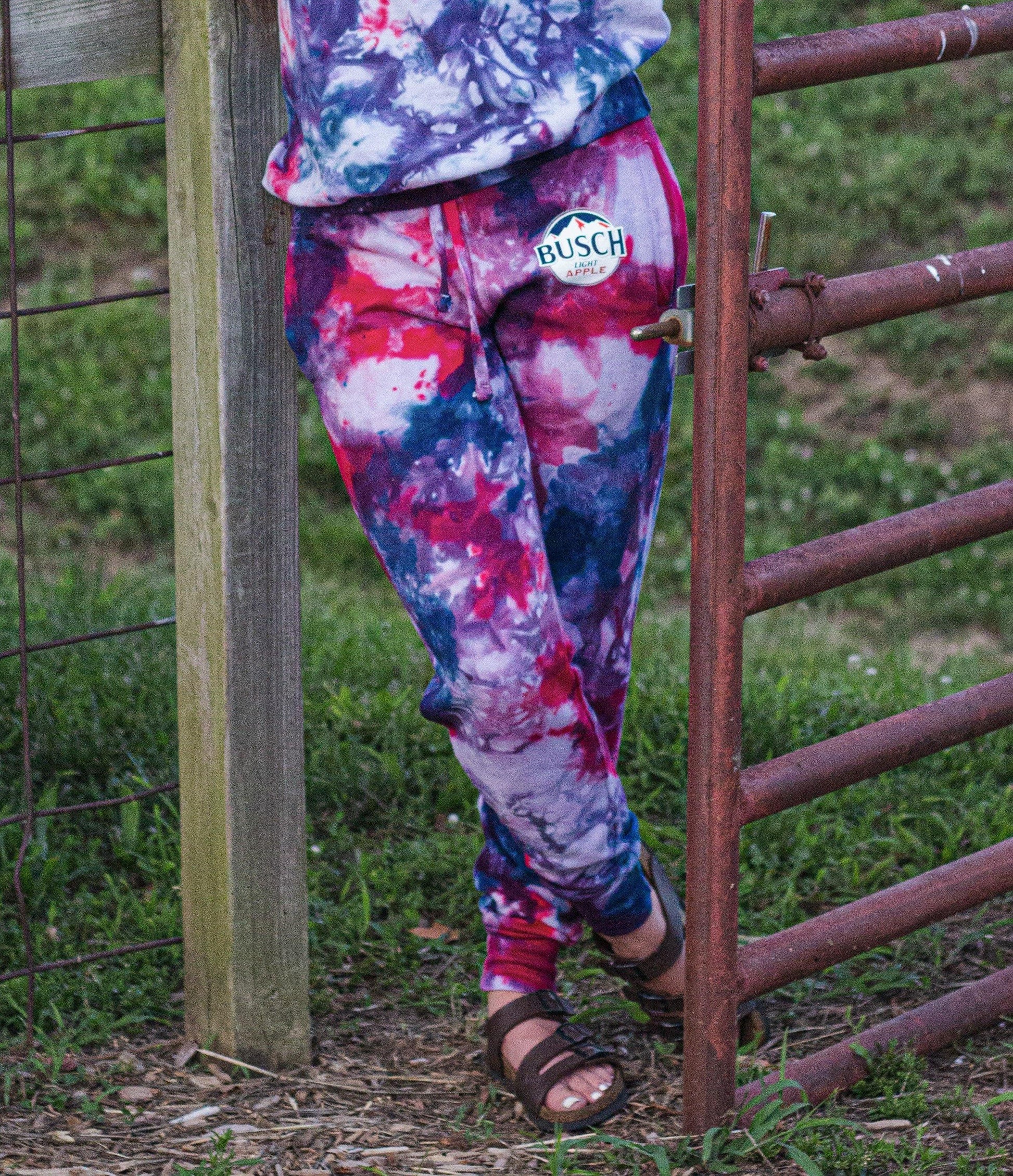 woman wearing busch light apple tie dye joggers