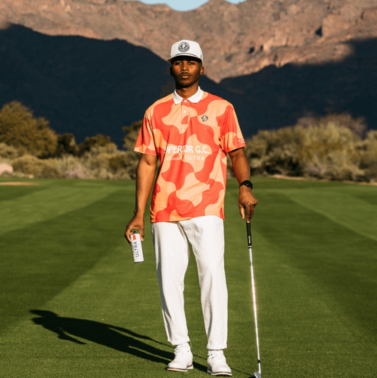 Lifestyle of man wearing orange and red polo