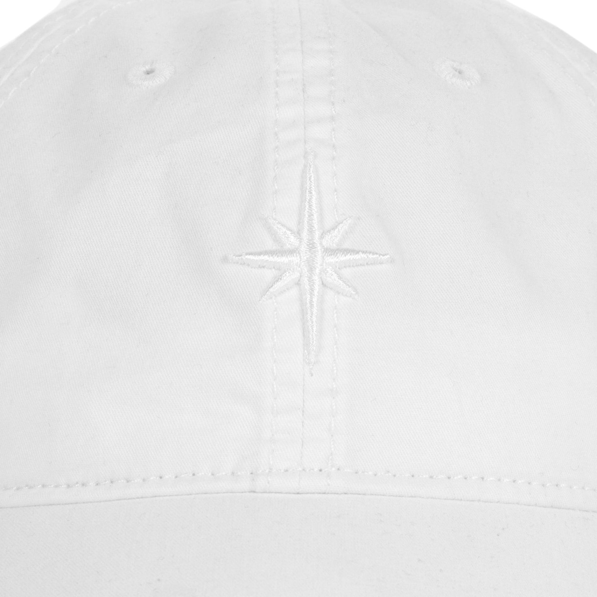 Close up of white embroidered Stella Artois star on front panel