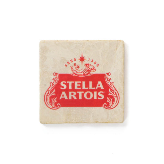 Cream colored square stone coaster with the one color red stella artois cartouche logo