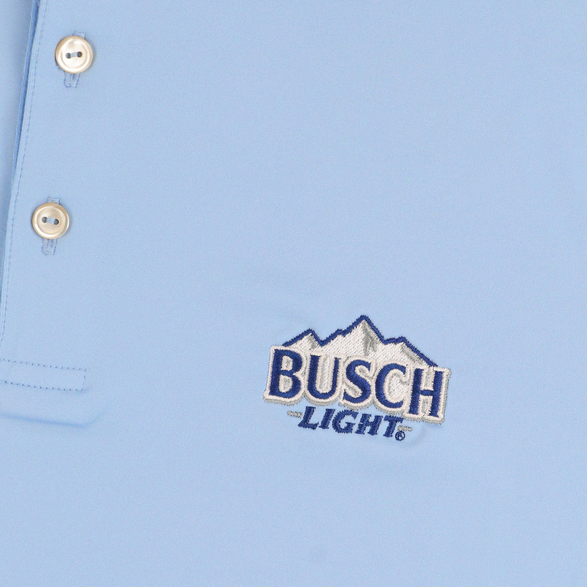 Close up of Busch Light logo on front left chest of polo